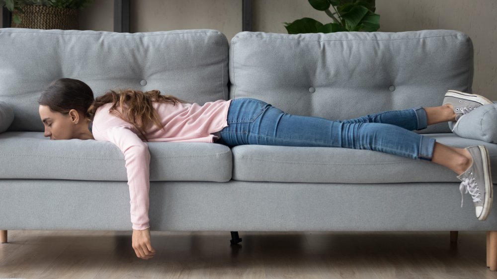 Woman napping on her couch