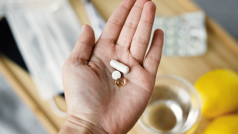 Man holding vitamins