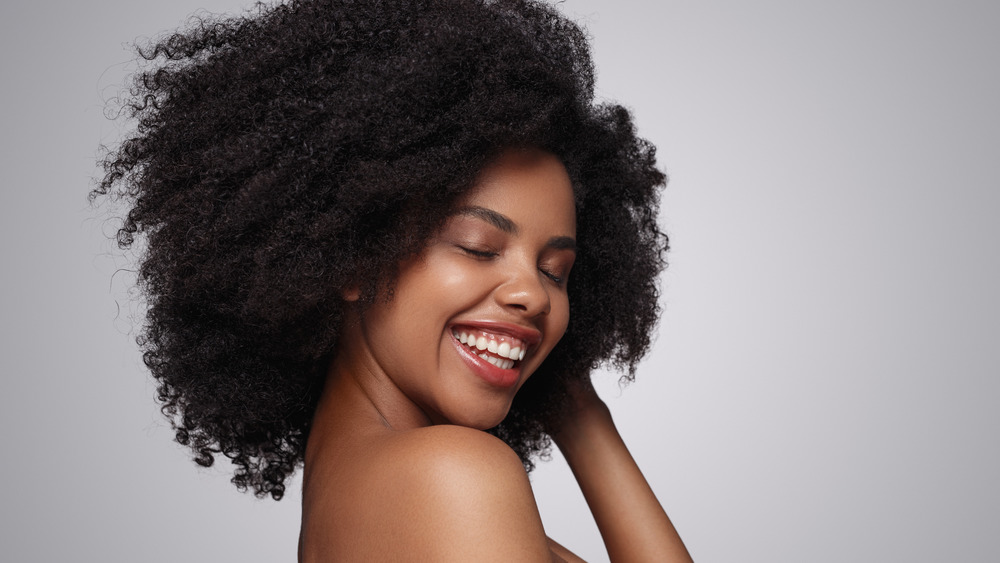 Woman with curly hair smiling