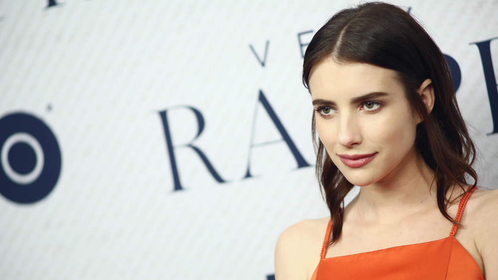 Emma Roberts wears orange on red carpet