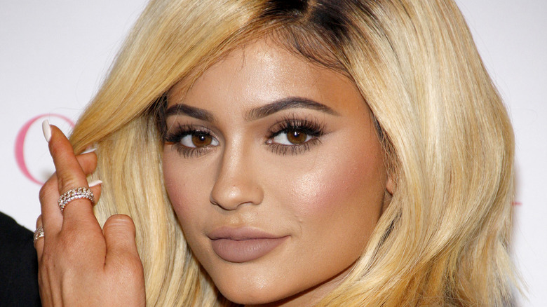 Kylie Jenner moving hair away from face