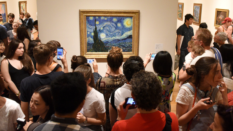 Tourists take pictures of Starry Night