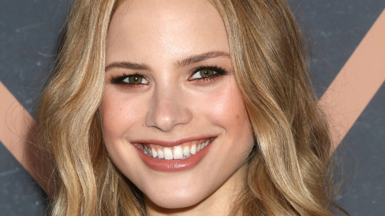 Halston Sage smiling