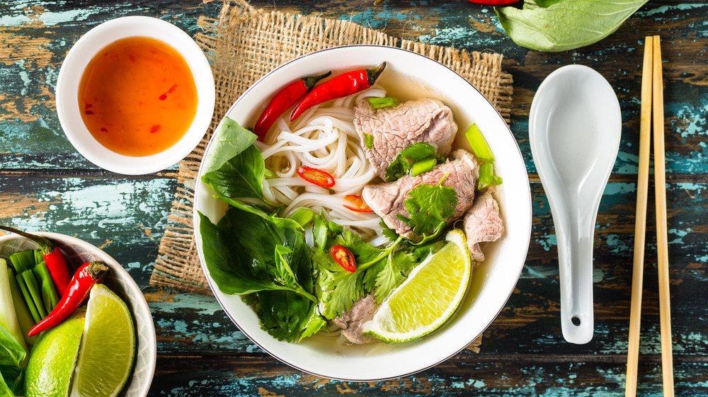 Bowl of pho on table