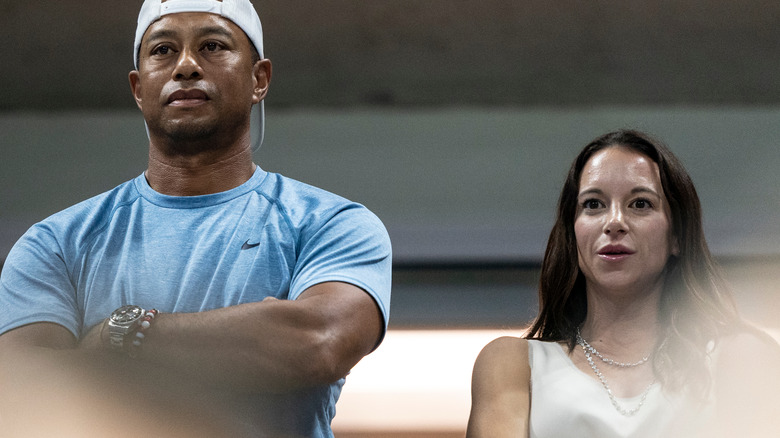 Erica Herman and Tiger Woods at event