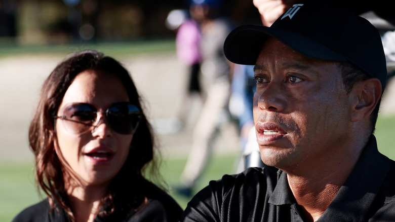 Erica Herman and Tiger Woods speaking
