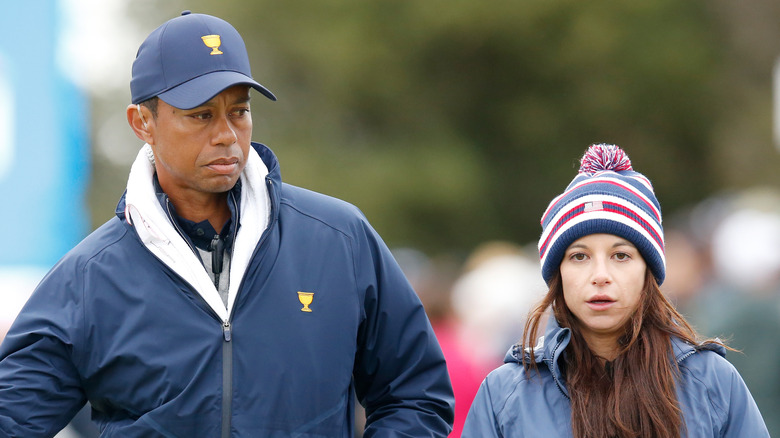 Erica Herman and Tiger Woods outside
