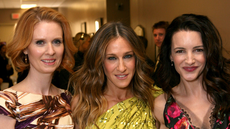 Sarah Jessica Parker, Cynthia Nixon, and Kristin Davis at an event. 