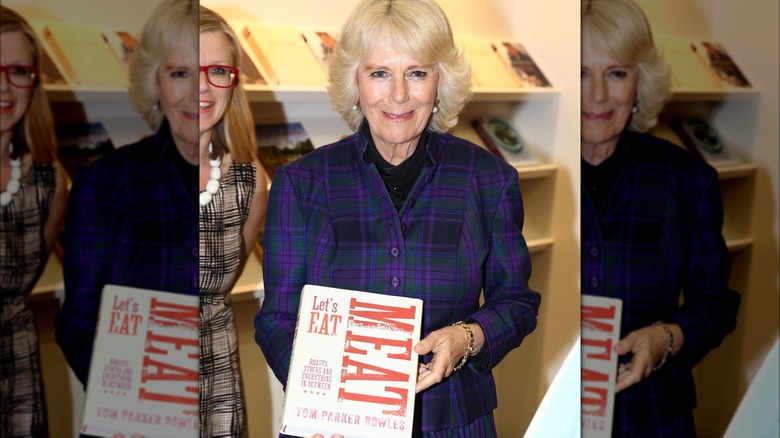 Camilla posing with book