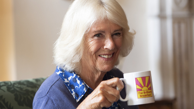 Camilla enjoying tea 