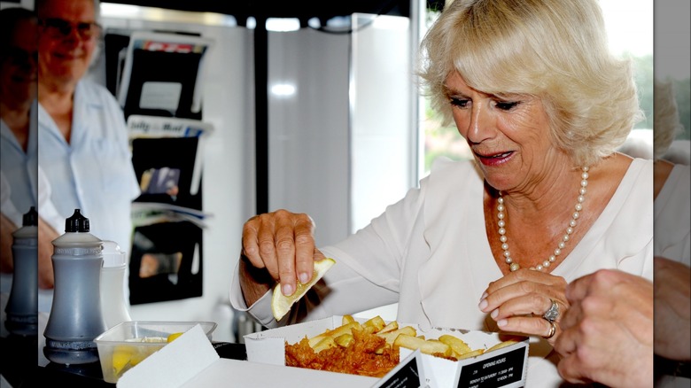 Camilla, queen consort, eating fish 