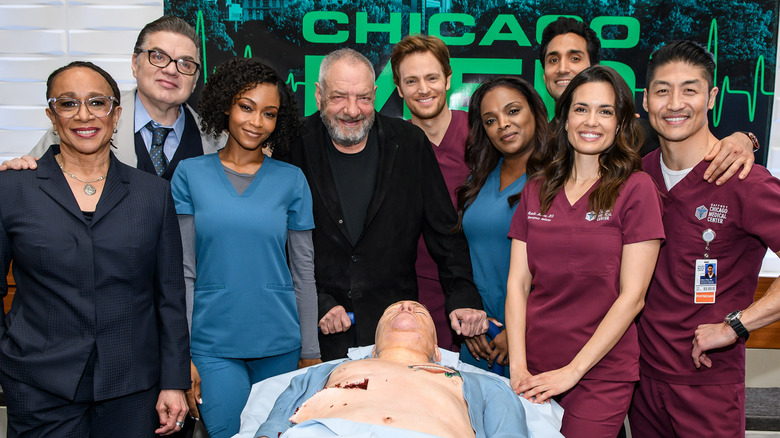 Cast of "Chicago Med" celebrating 100 episodes with "human" cake