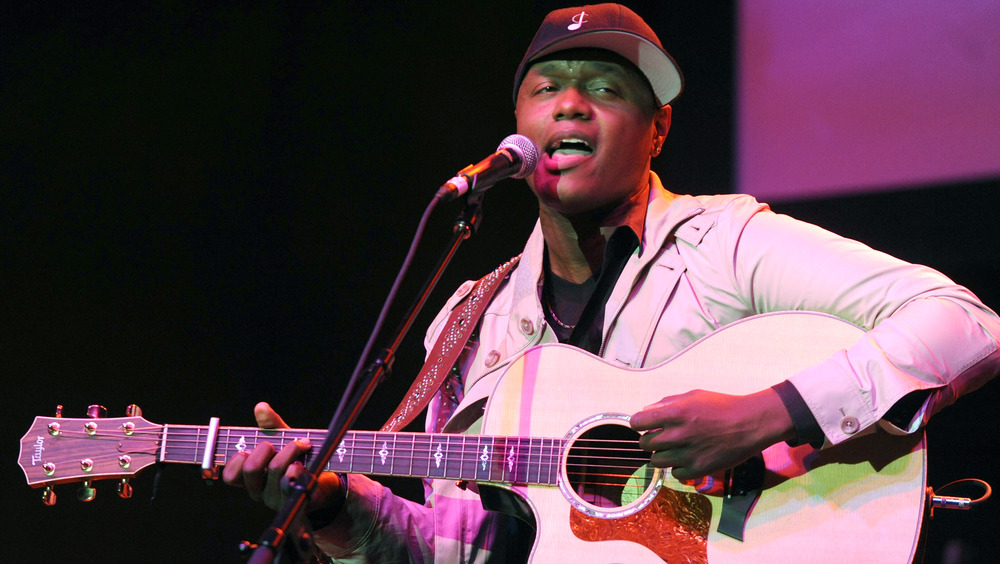 Javier Colon singing with guitar