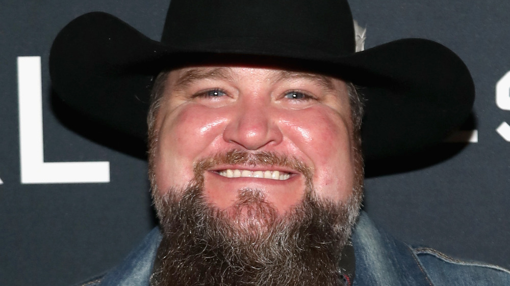 Sundance Head on red carpet in black cowboy hat