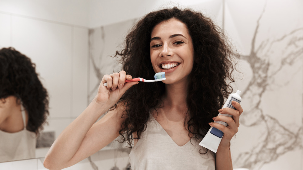 Woman brushing her teeth