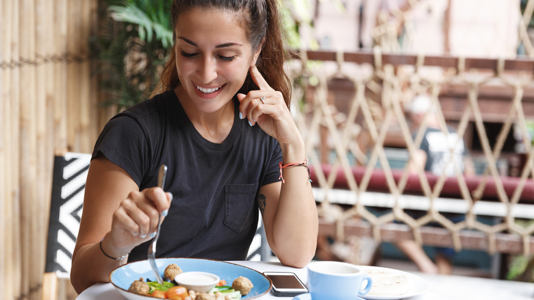 Young woman enjoying her meal