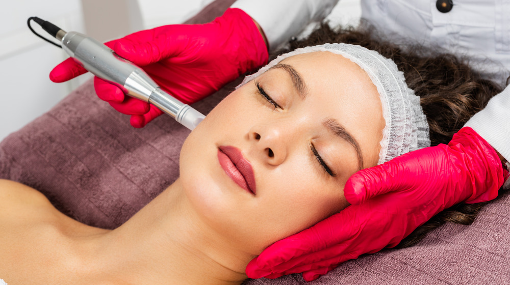 Woman having microneedling session