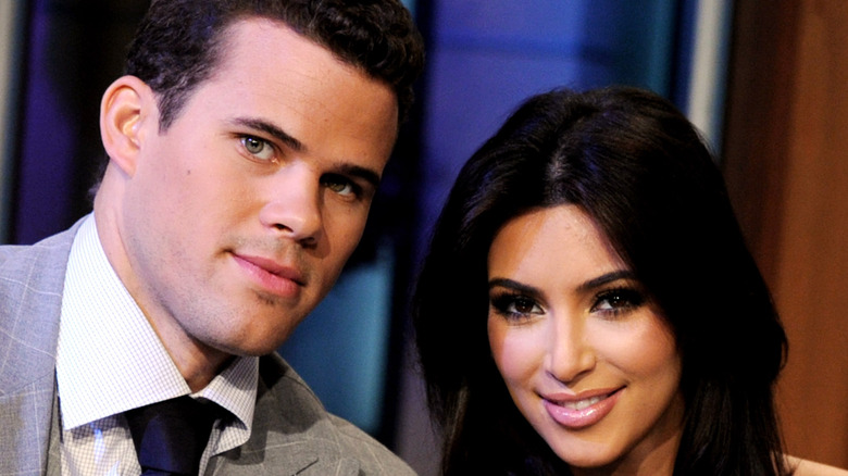 Kim Kardashian and Kris Humphries pose for the camera.