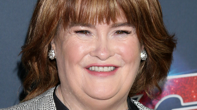 Susan Boyle smiling with bangs