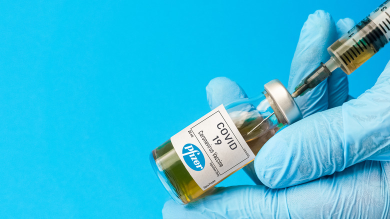 COVID-19 vaccine with hand