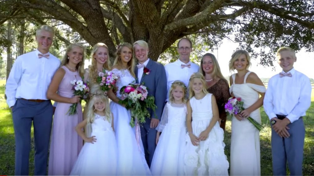 The Plathville kids with their parents