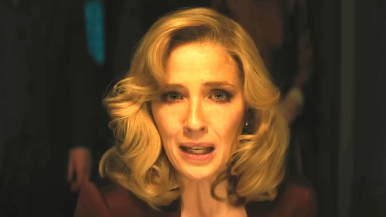 Kelly Reilly with blond hair and scared expression in A Haunting in Venice