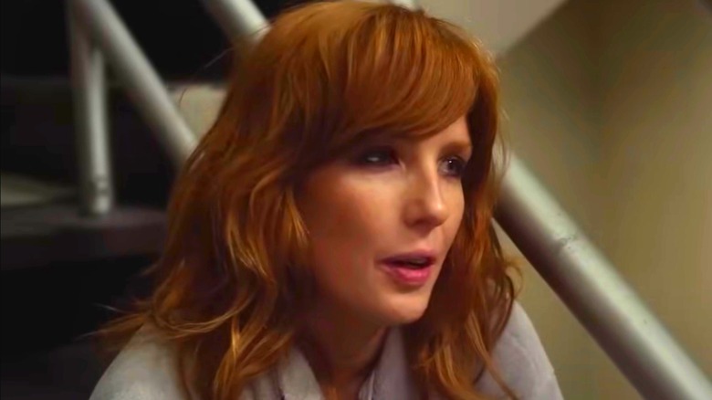 Kelly Reilly sitting on staircase with hair down in Flight