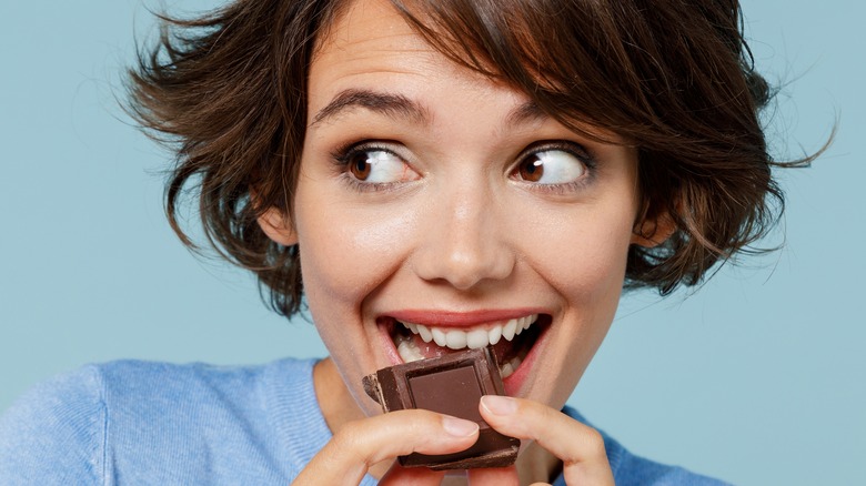 Woman eating chocolate