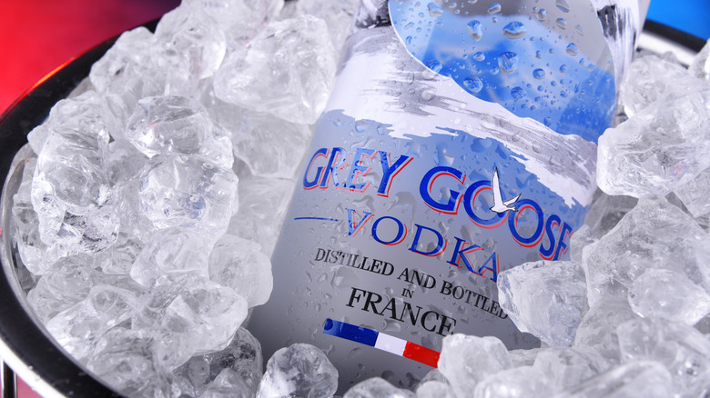 A bottle of grey goose vodka on ice 