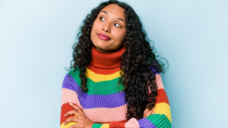 woman wearing rainbow sweater