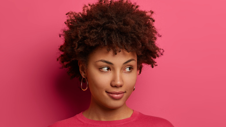 Woman wearing pink in front of pink background