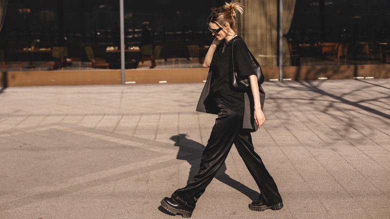 Woman walking in black outfit