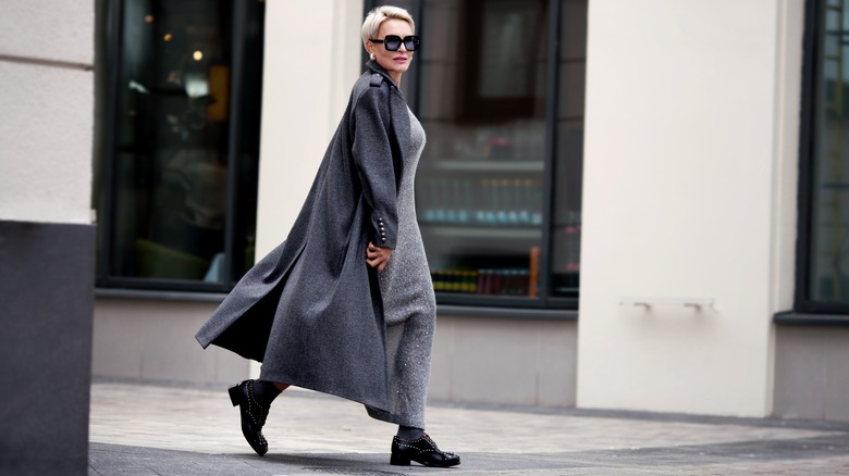 Woman on street wearing gray outfit