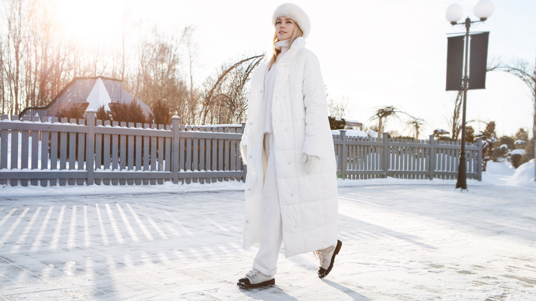 Woman wearing all white in snow
