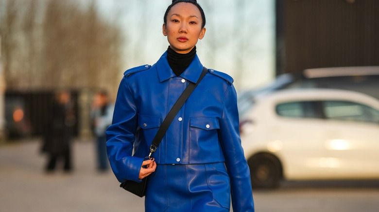 Woman wearing blue outfit on street