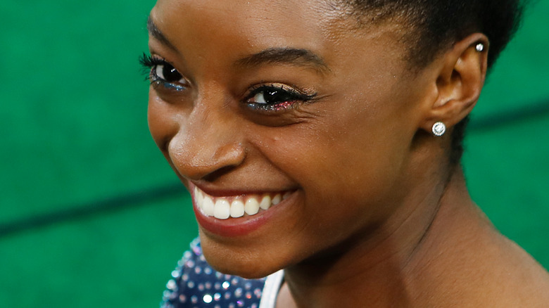 Simone Biles smiling at competition