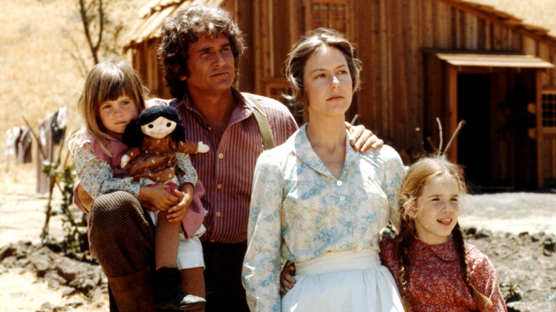 The cast of 'Little House on the Prairie' (1974) in costume on the show's set