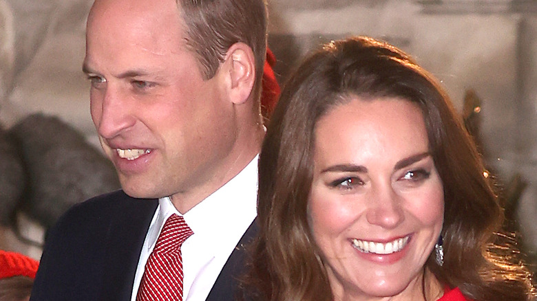 Prince William and Kate Middleton smiling at an event