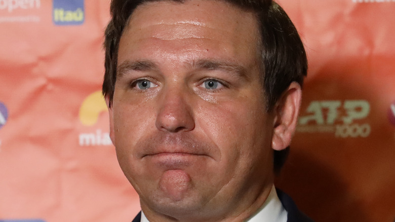 Governor Ron DeSantis staring off, sweating