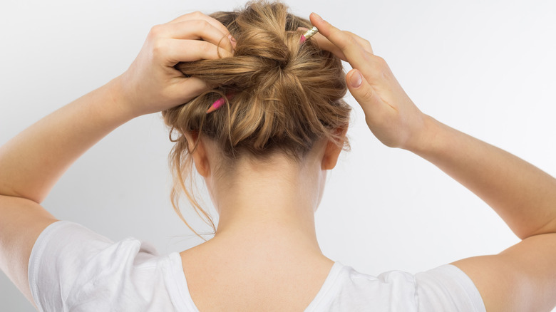 Girl with pencil in hair