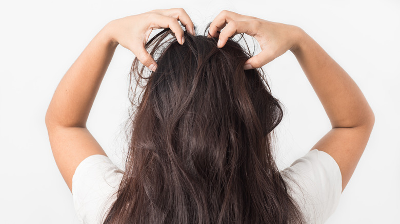 Woman massaging scalp 
