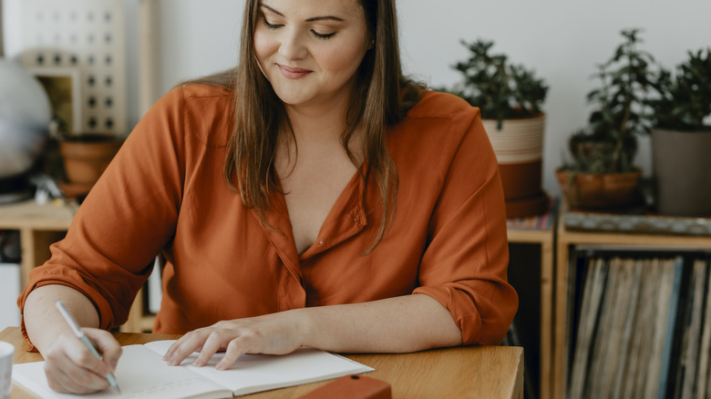 Woman writing a to-do list