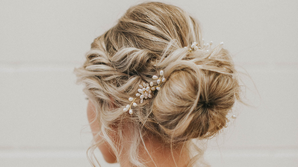 Back view of a chignon with pearl accessory