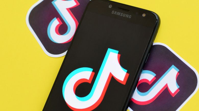 TikTok logo and samsung phone with tiktok app logo