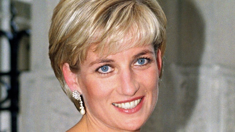 Princess Diana smiling while having her picture taken