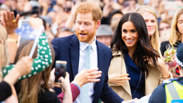 Prince Harry and Meghan Markle smiling