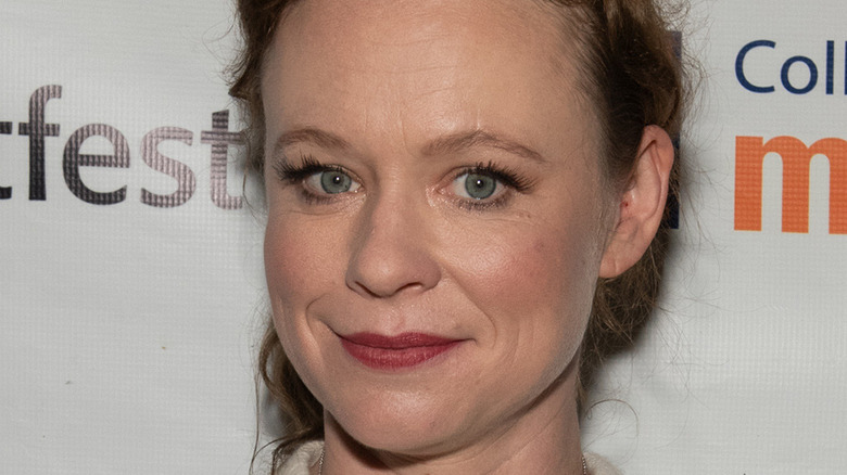 Thora Birch smiling at event