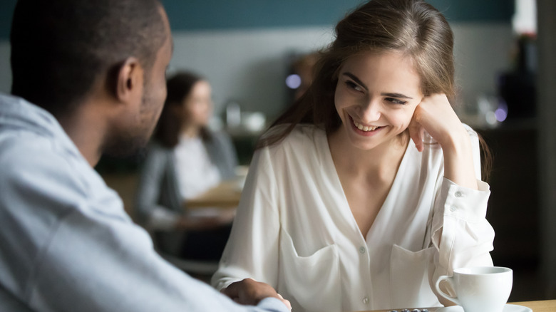 Couple at cafe smiling