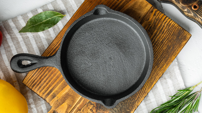 https://www.thelist.com/img/gallery/throw-your-cast-iron-pan-away-immediately-if-you-notice-this/its-time-to-throw-your-cast-iron-away-if-it-has-a-wobbly-base-1639668139.jpg