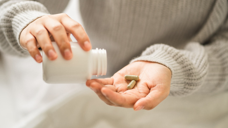 Woman taking supplements 